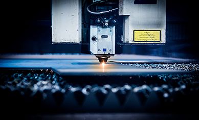 A laser cutting head over steel sheet